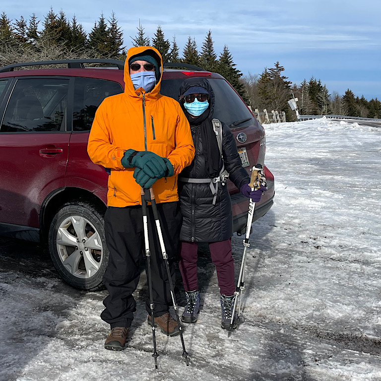 two people standing outside where it is very cold